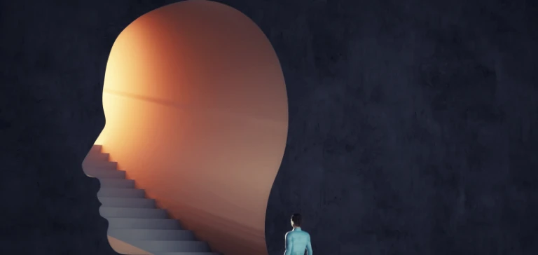 człowiek wchodzący po&nbsp;schodach